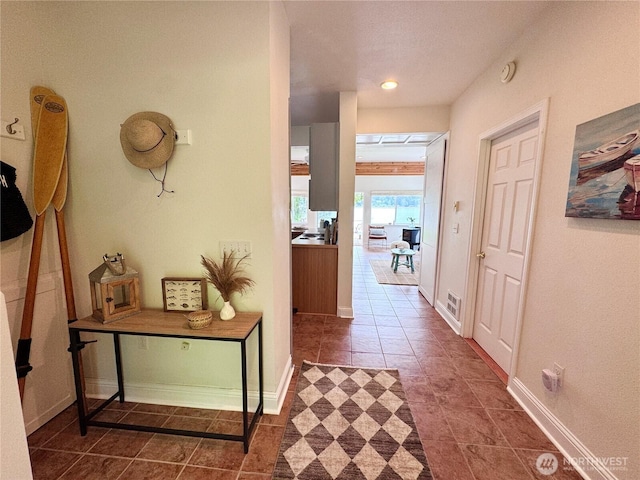 7610 E Grapeview Loop Rd, Allyn, WA 98524 - hall featuring tile patterned flooring, baseboards, and recessed lighting