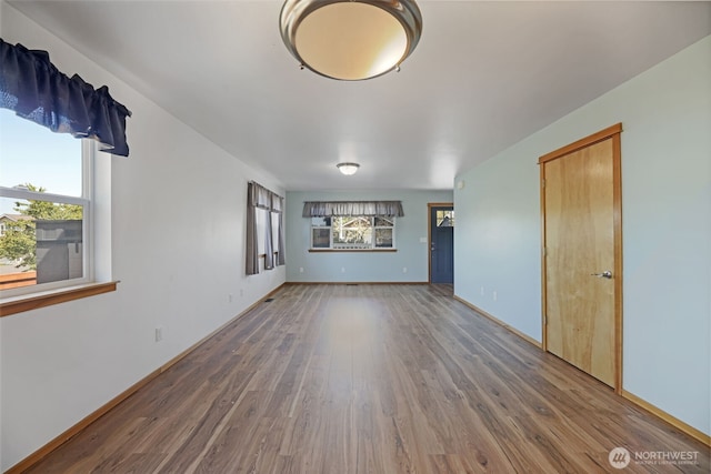 28540 74th Dr NW, Stanwood, WA 98292 - unfurnished living room with wood finished floors and baseboards