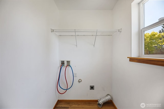 28540 74th Dr NW, Stanwood, WA 98292 - clothes washing area featuring washer hookup, hookup for an electric dryer, wood finished floors, and baseboards