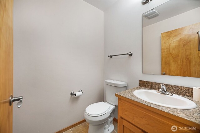 28540 74th Dr NW, Stanwood, WA 98292 - bathroom featuring toilet, vanity, baseboards, and tile patterned floors