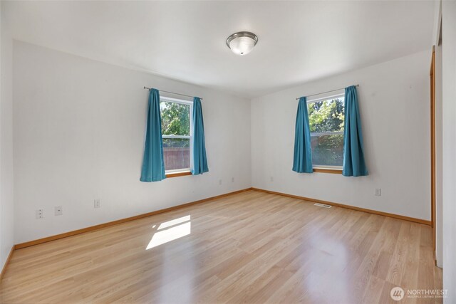 28540 74th Dr NW, Stanwood, WA 98292 - unfurnished room featuring wood finished floors and baseboards