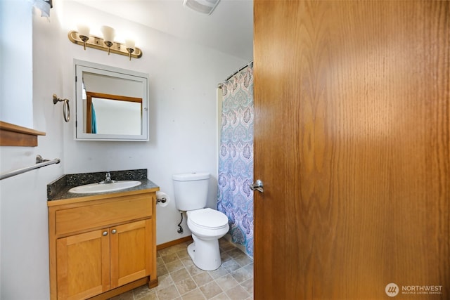 28540 74th Dr NW, Stanwood, WA 98292 - bathroom featuring toilet, vanity, and curtained shower