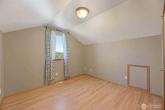 28540 74th Dr NW, Stanwood, WA 98292 - additional living space with wood finished floors, lofted ceiling, and baseboards