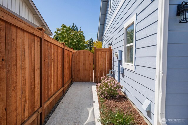 28540 74th Dr NW, Stanwood, WA 98292 - view of home's exterior featuring fence and a gate
