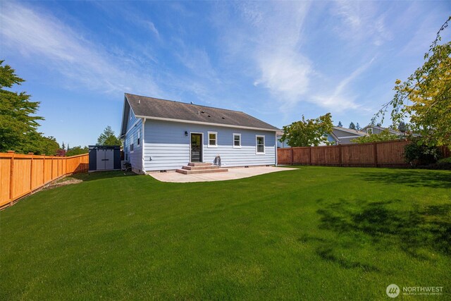 28540 74th Dr NW, Stanwood, WA 98292 - back of house featuring a patio area, a shed, an outbuilding, a shingled roof, and entry steps