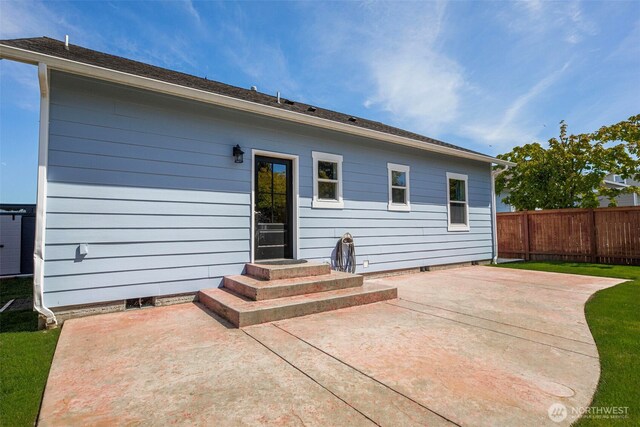 28540 74th Dr NW, Stanwood, WA 98292 - rear view of house with a patio and fence