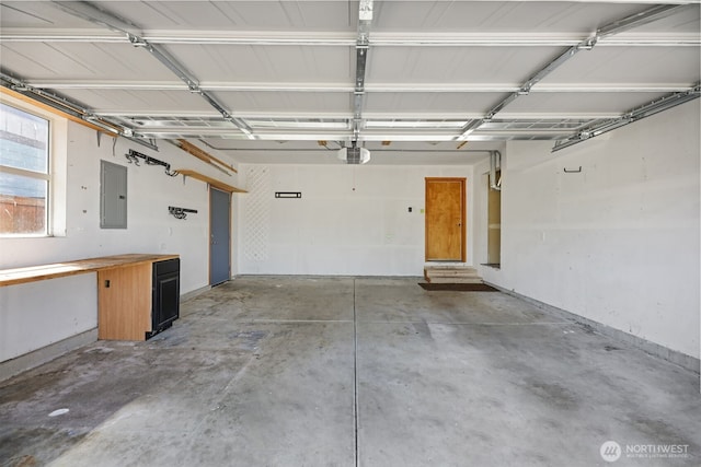 28540 74th Dr NW, Stanwood, WA 98292 - garage featuring electric panel and a garage door opener