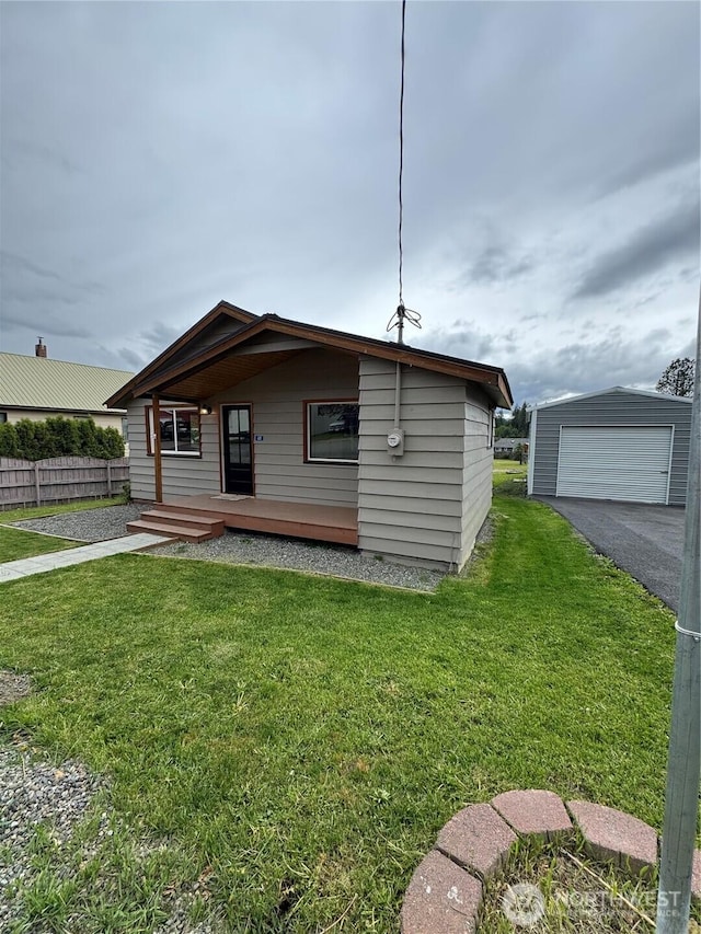 420 3rd St, Ronald, WA 98940 - view of front of property with a detached garage, asphalt driveway, and an outdoor structure