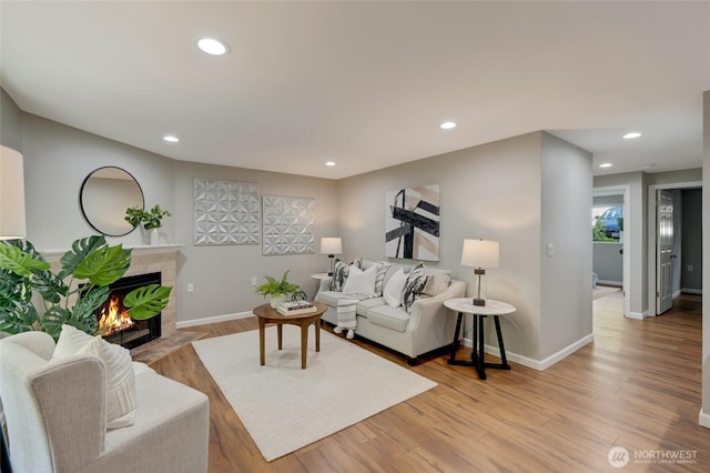 12724 NE 144th St Unit E-104, Kirkland, WA 98034 - living room with a fireplace, light wood-type flooring, recessed lighting, and baseboards