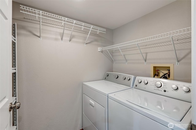 12724 NE 144th St Unit E-104, Kirkland, WA 98034 - laundry area with washing machine and clothes dryer