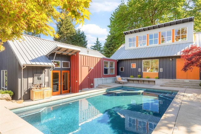 10611 NE 155th Pl, Bothell, WA 98011 - view of swimming pool with french doors and a pool with connected hot tub