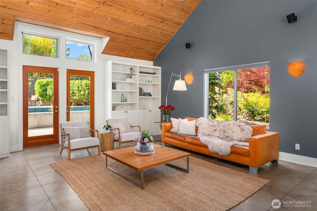 10611 NE 155th Pl, Bothell, WA 98011 - living area featuring high vaulted ceiling, wood ceiling, concrete floors, and baseboards
