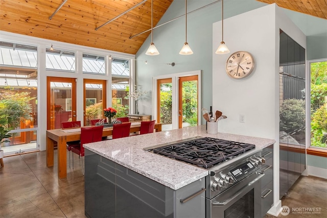 10611 NE 155th Pl, Bothell, WA 98011 - kitchen featuring stainless steel range with gas stovetop, gray cabinets, wooden ceiling, healthy amount of natural light, and high vaulted ceiling