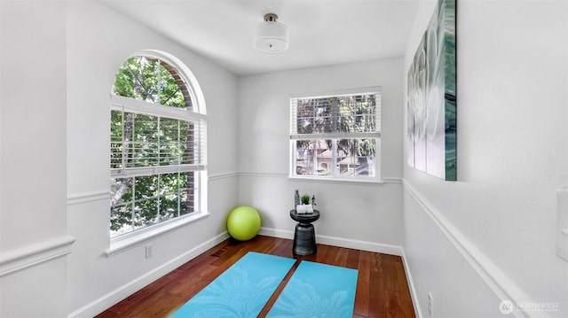 1734 Ilwaco Ave NE, Renton, WA 98059 - workout area with healthy amount of natural light, wood finished floors, and baseboards