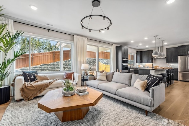 20304 154th St E Unit 15, Bonney Lake, WA 98391 - living area with light wood-style flooring and recessed lighting
