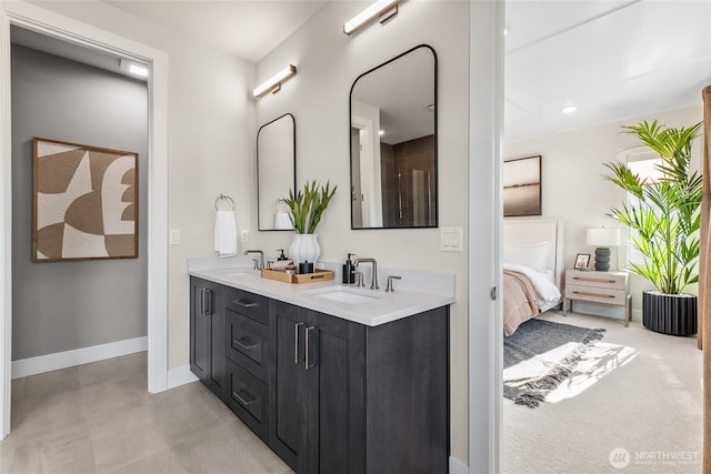 20304 154th St E Unit 15, Bonney Lake, WA 98391 - ensuite bathroom with double vanity, baseboards, and recessed lighting