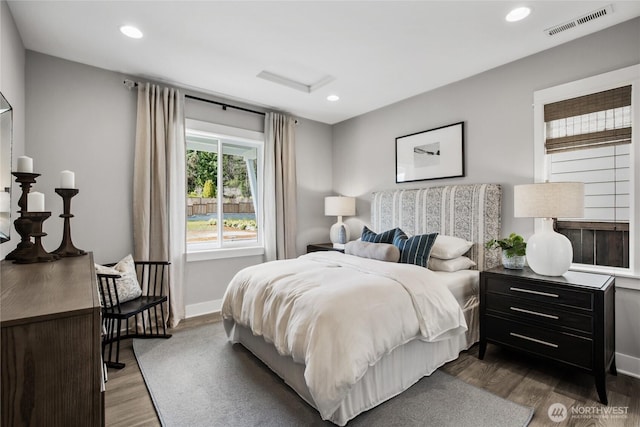 15321 204th Ave E Unit 56, Bonney Lake, WA 98391 - bedroom with dark wood-style floors, recessed lighting, and baseboards