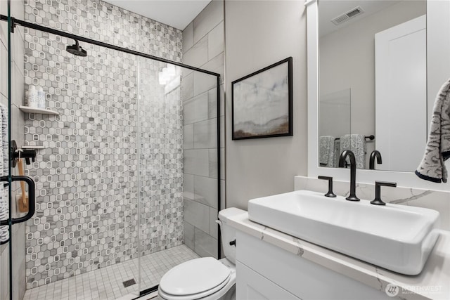 15321 204th Ave E Unit 56, Bonney Lake, WA 98391 - bathroom featuring a stall shower, toilet, and vanity
