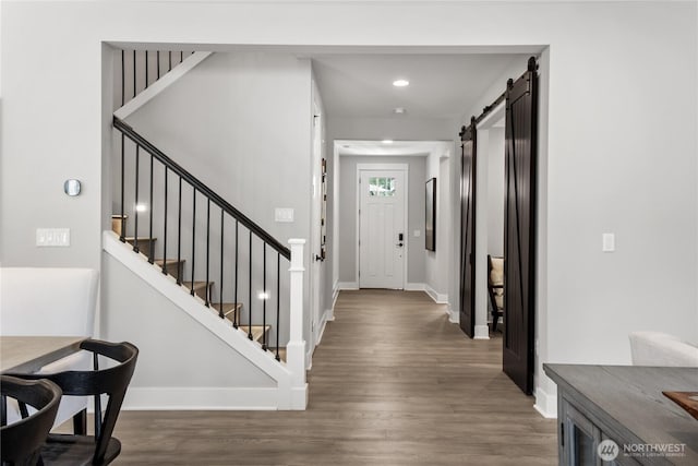 15321 204th Ave E Unit 56, Bonney Lake, WA 98391 - entryway with wood finished floors, a barn door, stairway, baseboards, and recessed lighting