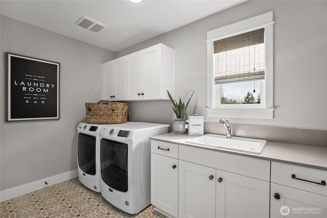 15321 204th Ave E Unit 56, Bonney Lake, WA 98391 - washroom featuring cabinet space, independent washer and dryer, and baseboards
