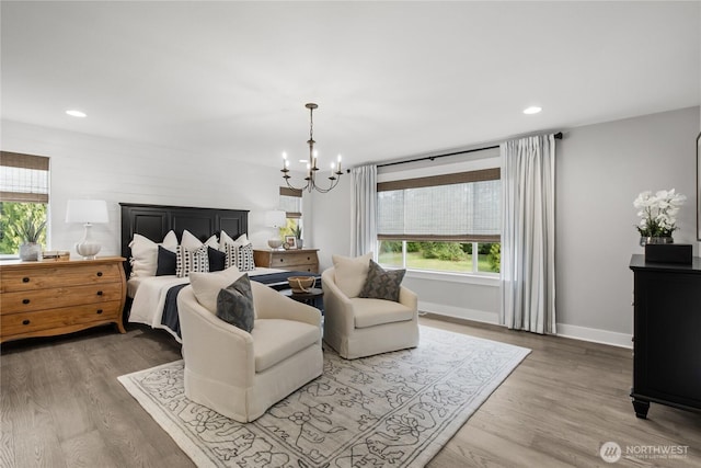 15321 204th Ave E Unit 56, Bonney Lake, WA 98391 - bedroom with a chandelier, wood finished floors, recessed lighting, and baseboards