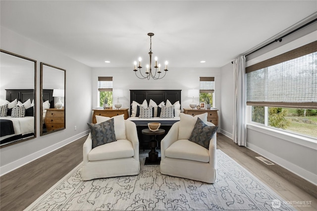 15321 204th Ave E Unit 56, Bonney Lake, WA 98391 - bedroom with a chandelier, wood finished floors, baseboards, and recessed lighting