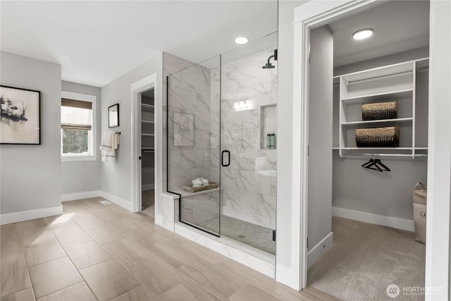 15321 204th Ave E Unit 56, Bonney Lake, WA 98391 - bathroom with a spacious closet, baseboards, a marble finish shower, and recessed lighting
