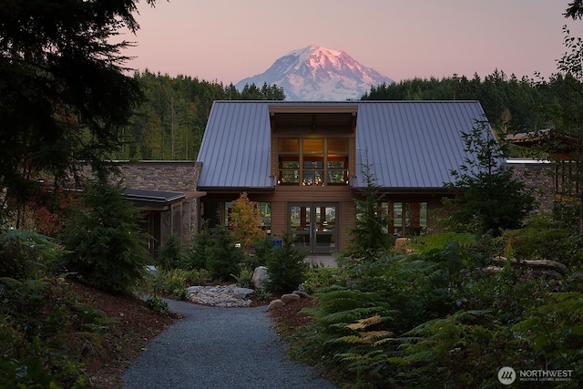 15321 204th Ave E Unit 56, Bonney Lake, WA 98391 - view of front of home with a mountain view, metal roof, and french doors