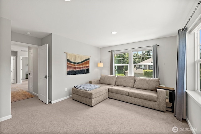 carpeted living room featuring baseboards and recessed lighting