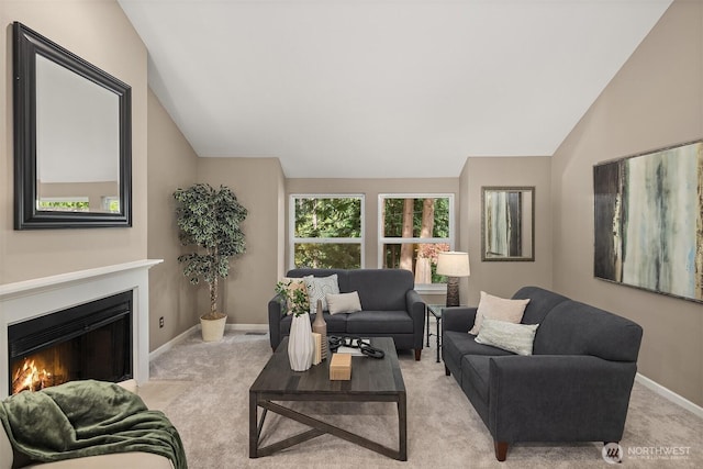 1020 Greenwood Blvd SW, Issaquah, WA 98027 - living room featuring lofted ceiling, a fireplace with flush hearth, carpet flooring, and baseboards