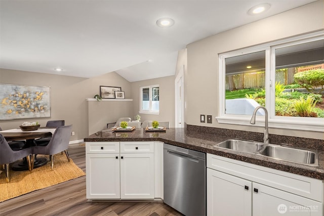 1020 Greenwood Blvd SW, Issaquah, WA 98027 - kitchen with dishwasher, a sink, a peninsula, lofted ceiling, and white cabinets