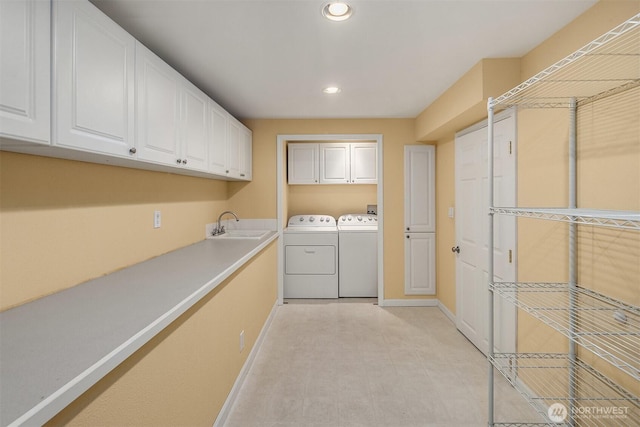 1020 Greenwood Blvd SW, Issaquah, WA 98027 - washroom with cabinet space, separate washer and dryer, baseboards, and recessed lighting