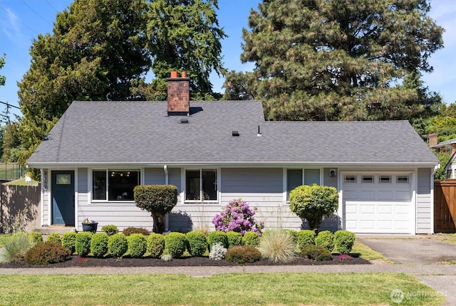 8155 28th Ave SW, Seattle, WA 98126 - view of front of property featuring a chimney, a garage, roof with shingles, and driveway