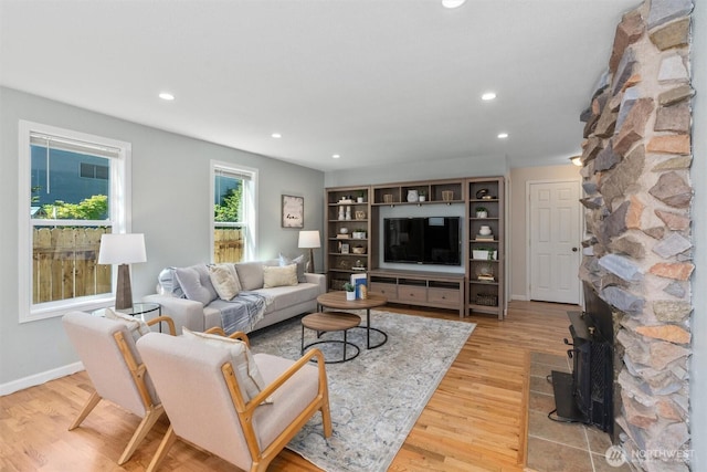 8155 28th Ave SW, Seattle, WA 98126 - living area featuring light wood-type flooring, recessed lighting, and baseboards