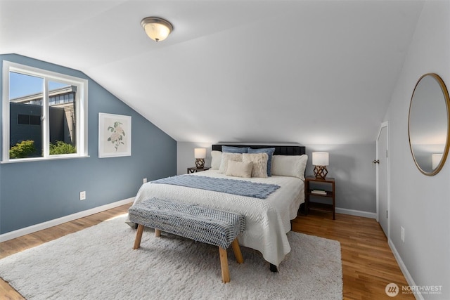 8155 28th Ave SW, Seattle, WA 98126 - bedroom with wood finished floors, vaulted ceiling, and baseboards