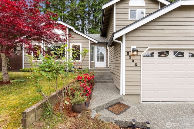 doorway to property featuring a yard