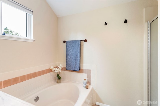 full bath with a garden tub