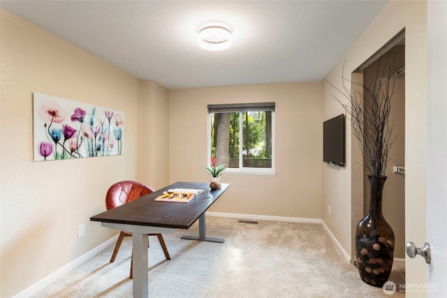 carpeted office with baseboards