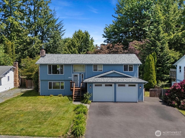 17417 29th Dr SE, Bothell, WA 98012 - raised ranch featuring asphalt driveway, a chimney, a garage, and roof with shingles