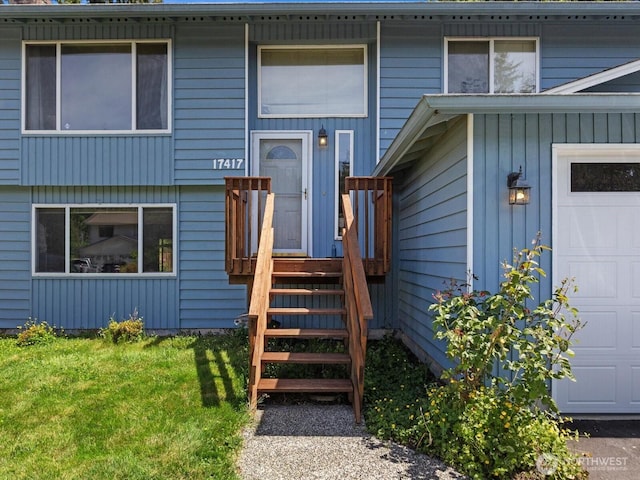 17417 29th Dr SE, Bothell, WA 98012 - view of exterior entry featuring a garage and a lawn