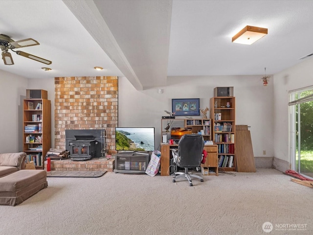 17417 29th Dr SE, Bothell, WA 98012 - home office with a wood stove, carpet, and ceiling fan