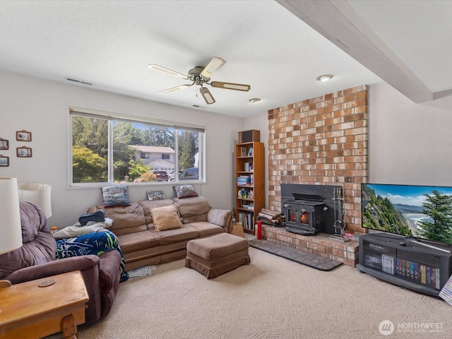 17417 29th Dr SE, Bothell, WA 98012 - carpeted living area with a wood stove and ceiling fan