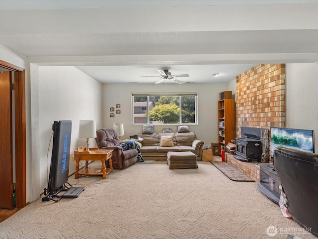 17417 29th Dr SE, Bothell, WA 98012 - living room with a wood stove, carpet floors, and a ceiling fan