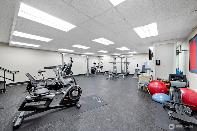 708 Market St Unit 409, Tacoma, WA 98402 - workout area with a paneled ceiling and baseboards
