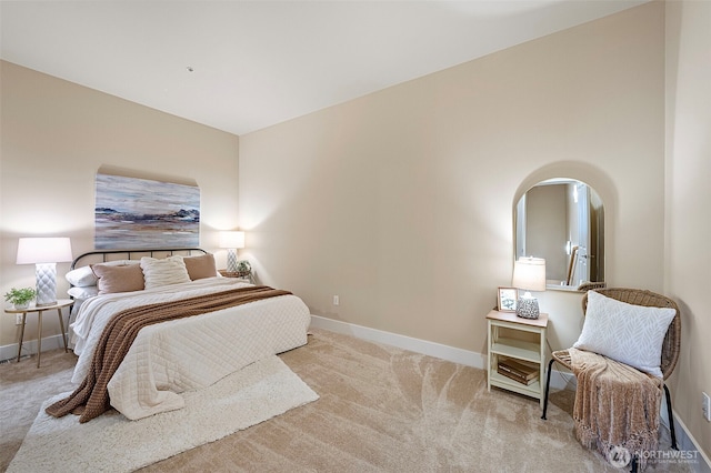 708 Market St Unit 409, Tacoma, WA 98402 - bedroom with carpet, baseboards, and arched walkways