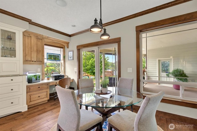 45 N Welcome Slough Rd, Cathlamet, WA 98612 - dining space featuring light wood finished floors and crown molding