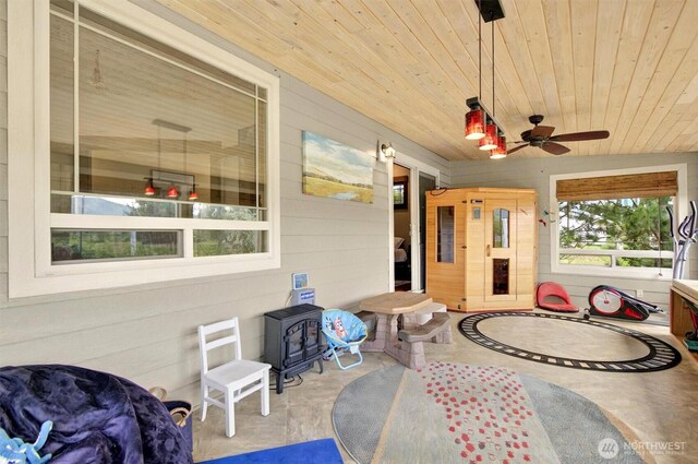 45 N Welcome Slough Rd, Cathlamet, WA 98612 - sunroom / solarium featuring a wood stove