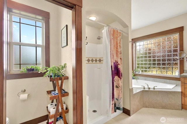 45 N Welcome Slough Rd, Cathlamet, WA 98612 - full bathroom with a stall shower, a garden tub, tile patterned floors, and baseboards