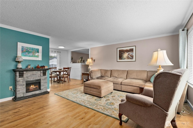 2313 N 19th Pl, Mount Vernon, WA 98273 - living room with a textured ceiling, crown molding, wood finished floors, and baseboards