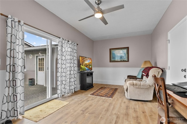 2313 N 19th Pl, Mount Vernon, WA 98273 - living area with wood finished floors, a wainscoted wall, and ceiling fan